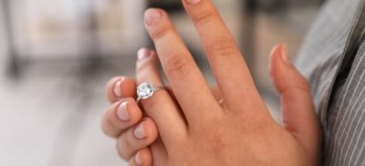 Woman taking her wedding ring off